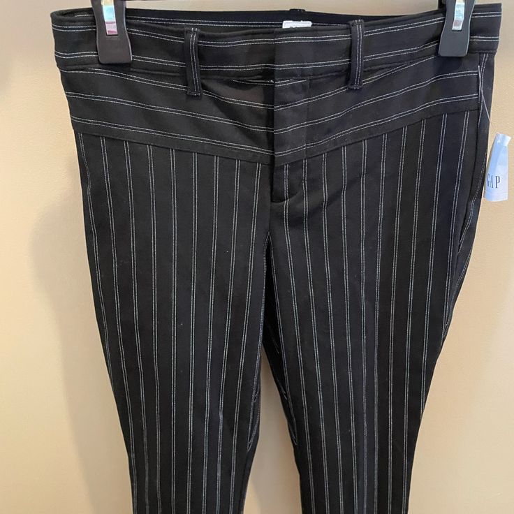 Really Cute New Black Pinstriped Ankle Pants Approx 27 In From Inseam. They Have Some Stretch. Very Comfortable. 2 Closed Design Only Pockets I’m Back. Front Closure Zipper Two Hooks And A Button. Very Good Quality. Look Really Nice On For Work Or Casual Don’t Fit. Never Worn. Has Tags On Them. Pinstripe Fitted Ankle-length Bottoms, Fitted Pinstripe Ankle-length Bottoms, Fitted Pinstripe Ankle-length Pants, Fitted Ankle-length Pants With Vertical Stripes, Fitted Vertical Stripes Ankle-length Bottoms, Fitted Vertical Striped Ankle-length Pants, Gap Black Wide Leg Bottoms, Gap Black Wide Leg Pants, Striped Fitted Bottoms With Tapered Leg