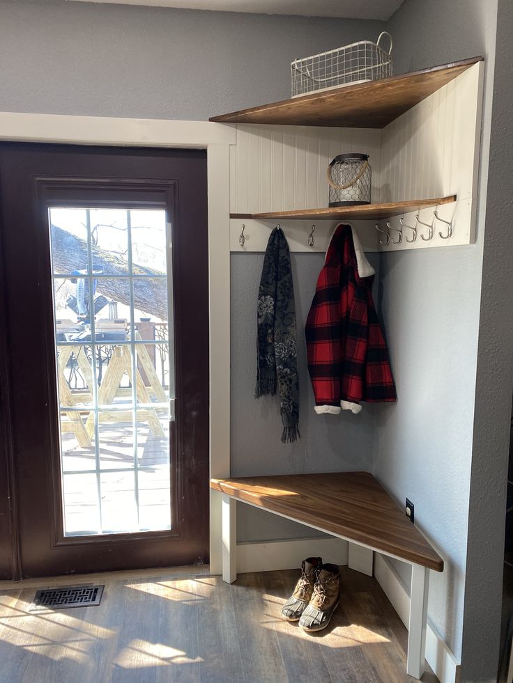 the entryway is clean and ready to be used as a mudroom for shoes