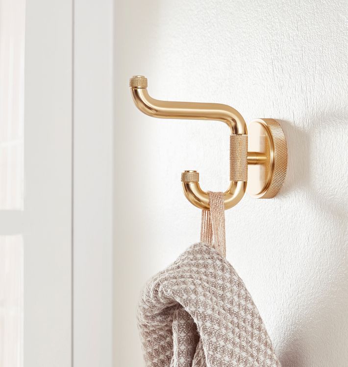 a towel hanging from a hook on a wall