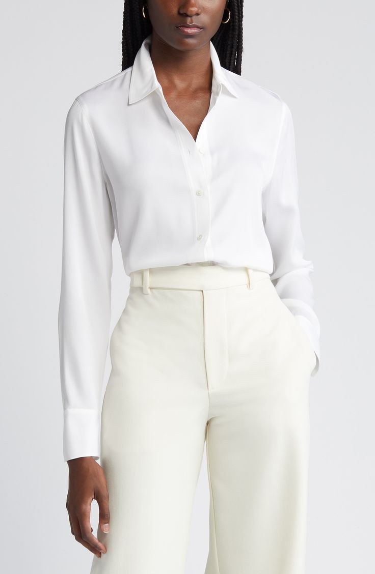 This versatile button-up blouse is irresistibly updated in luxe stretch silk with easy-moving back pleats and a tuckable high/low hem. 27" length (size Medium) Front button closure Spread collar Long sleeves with single-button cuffs Back yoke with box pleat 92% silk, 8% spandex Dry clean or hand wash, line dry Imported Individualist Fitted Blouse With Shirttail Hem, Tailored Sleek Tops For Work, Fitted Blouse With Shirttail Hem For Business Casual, Sleek Tops For Workwear, Classic Solid Viscose Blouse, Elegant Fitted Blouse With Shirttail Hem, Classic Tailored Blouse For Business Casual, Tailored Tops With Hidden Button Closure, Fitted Viscose Blouse For Office