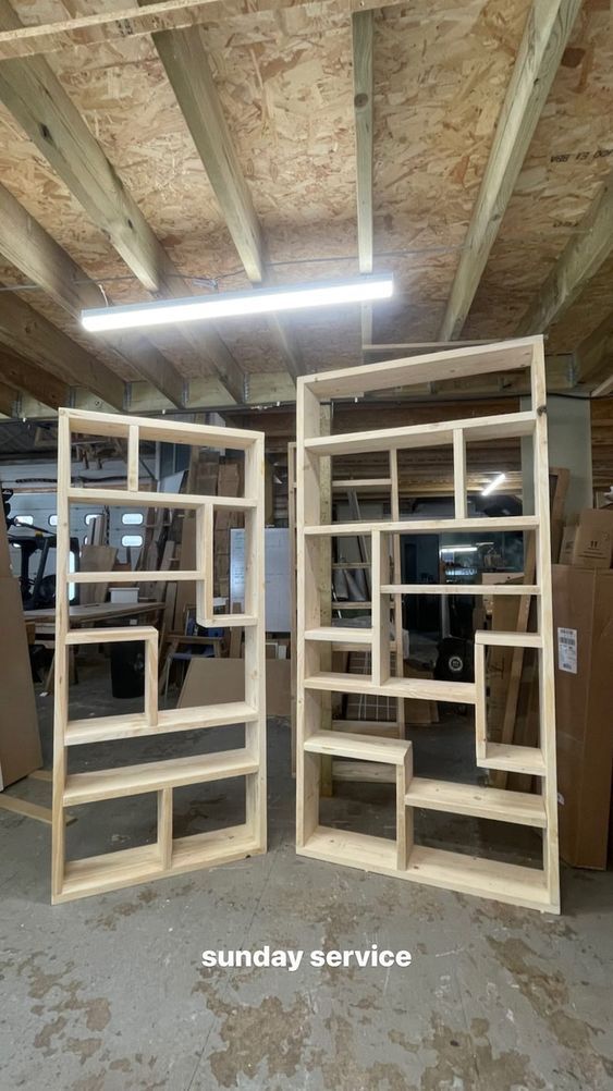 two wooden shelves in the middle of a room