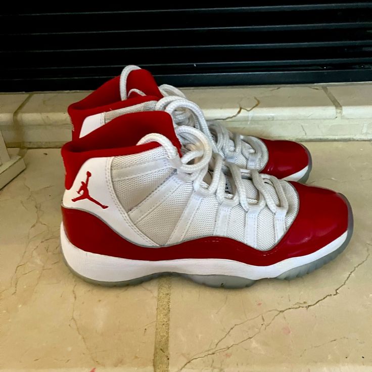 Jordan 11 2022 Cherry. Excellent Used Condition. Unisex School Age 4y. Can Be Cleaned Up To Look Brand New! Worn A Handful Of Times Before They Were Outgrown. No Box University Red Casual Basketball Shoes With Round Toe, Casual University Red Basketball Shoes With Round Toe, Casual White Basketball Shoes With Red Sole, Casual Jordan Shoes In University Red, Red Sneakers With White Laces And Round Toe, Red Sneakers With White Laces, Casual Red Sneakers With White Laces, Red Sports Sneakers With White Laces, Red Sneakers With White Laces For Sports