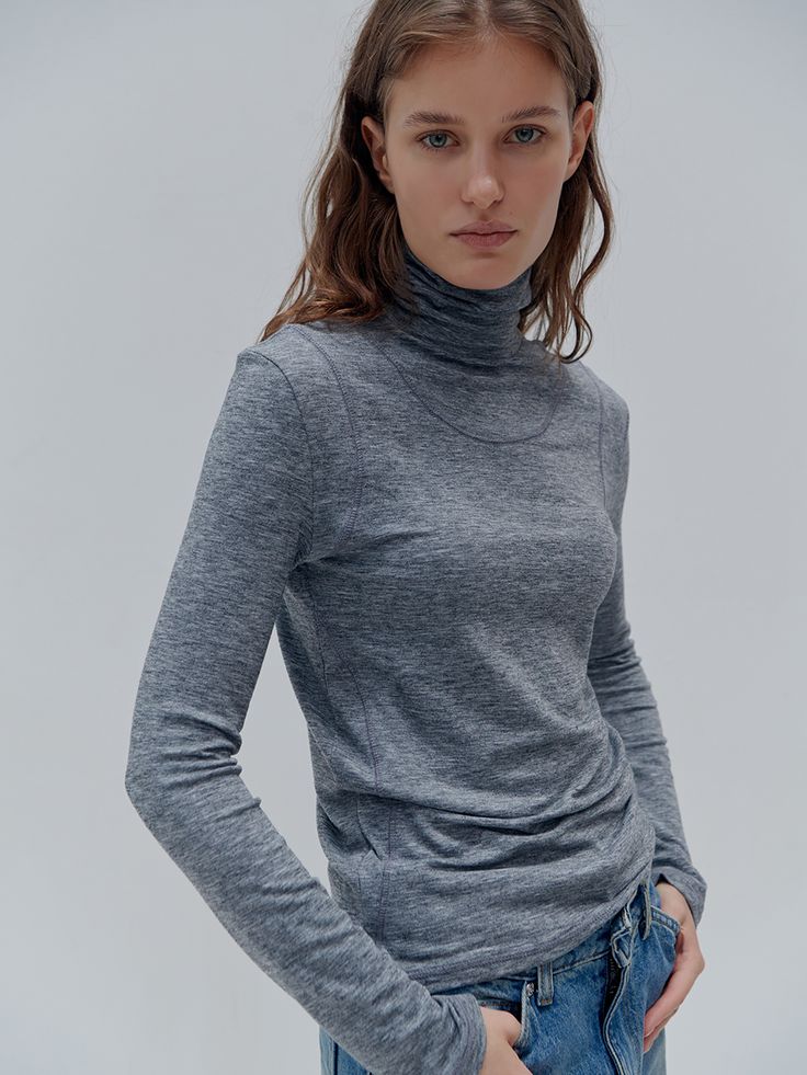 Editor's Notes Casual and unique top that has soft and stretchy texture. Featuring the classic turtleneck, layered-like design that gives unique mood, and the logo embroidey detail at the back. Style with various kinds of bottoms like denim jeans, slacks, or skirts to complete the trendy outfits. - Thick fabric- Stitch line - Logo embroidery - Fitted silhouette Measurements(in.)ONE SIZE (XS-M)- Total Length: 25.98 in- Shoulder: 15.74 in- Chest: 16.14 in- Sleeve length:23 Layered Turtleneck, Classic Turtleneck, Stitch Lines, Unique Top, Thick Fabric, Fitted Silhouette, Logo Embroidery, Embroidery Logo, Trendy Outfits