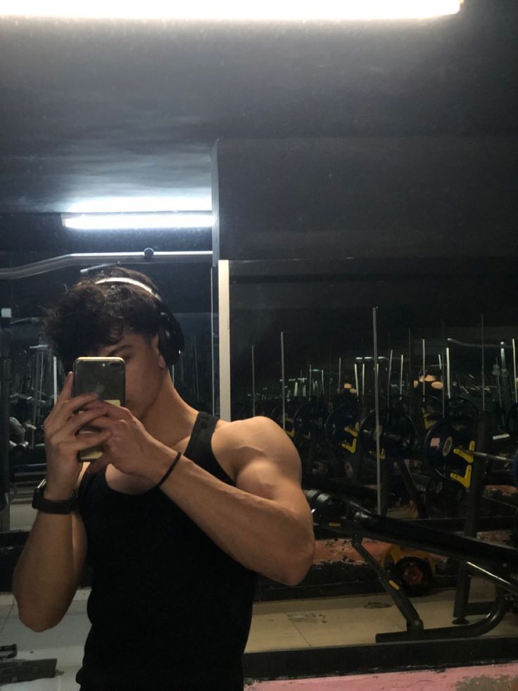 a man taking a selfie in the gym