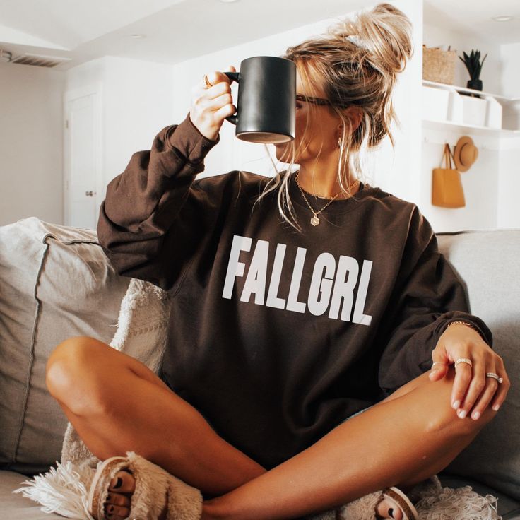 Calling all fall-loving girls--your new favorite sweatshirt has arrived! 🍂 Our FALLGRL sweatshirt is the ultimate must-have for anyone who lives for pumpkin spice, crisp air, and cozy nights. This trendy design combines comfort and style, making it perfect for everything from pumpkin patch visits to bonfire hangouts.  Don't just dream about fall--live it in the FALLGRL sweatshirt and make this your best autumn season yet! 🍁 A sturdy and warm sweatshirt bound to keep you warm in the colder months. A pre-shrunk, classic fit sweater that's made with air-jet spun yarn for a soft feel and reduced pilling. * 50% cotton, 50% polyester * Pre-shrunk * Classic fit * 1x1 athletic rib knit collar with spandex * Air-jet spun yarn with a soft feel and reduced pilling * Double-needle stitched collar, s Cute College Tops For Fall, Cute Fall Loungewear Sweatshirt, Cute Fall Letter Print Sweatshirt, Cute Letter Print Sweatshirt For Fall, Cozy Fall Tops For College, Fall Apparel, Fall Shirts Women, Sweater Autumn, Cozy Season