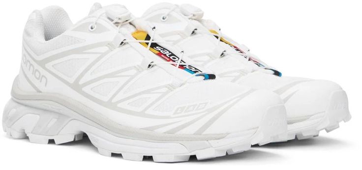 Salomon.White XT-6 Sneakers.Low-top mesh sneakers in white..· Bonded TPU trim throughout.· Quicklace® closure with Sensifit technology.· Logo patch at padded tongue.· Padded collar.· Logo printed at sides.· Mesh and EndoFit™ jersey lining.· Molded OrthoLite® footbed.· Agile Chassis™ System at midsole.· Treaded Contagrip® EVA rubber sole.Supplier color: White/White/Lunar rock.Upper: textile. Sole: rubber..Made in Viet Nam..241837M237021 Salomon Shoes, Mesh Sneakers, Technology Logo, Shoes Casual, White White, Mens Casual Shoes, Shoe Collection, Casual Sneakers, Low Top