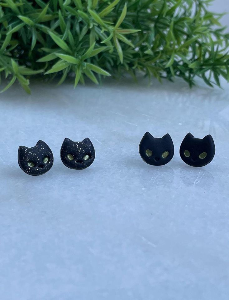 Black Cat Stud Polymer Clay Earrings Matte black, or black sparkle Approximately 13mm x 12mm Novelty Cat Ears Jewelry Gift, Cute Black Cat Design Earrings, Black Cat Ears Jewelry For Gifts, Black Cat Ears Jewelry As A Gift, Cute Black Pierced Jewelry, Adjustable Cat Ears Earrings For Gift, Adjustable Cat Ears Earrings As Gift, Hypoallergenic Cat Ears Earrings For Gift, Whimsical Black Jewelry For Gifts