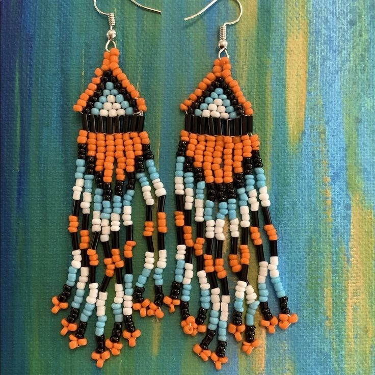 Boho Beaded Tribal Earrings With Orange, White, Turquoise, & Black Beads One Size About 4” Long New With Tag Orange Dangle Beaded Earrings With Black Beads, Orange And Black Beads Dangle Earrings, Orange Dangle Earrings With Black Beads, Orange Dangle Jewelry With Black Beads, Orange Beaded Earrings With Black Beads, Orange Adjustable Beaded Earrings For Festival, Adjustable Orange Beaded Earrings For Festival, Orange Dangling Beads For Festivals, Orange Dangling Beads For Festival