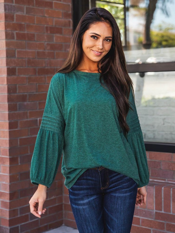 Introducing the 3/4 Pleated Sleeve Casey Top, the perfect addition to your fall wardrobe! This simple yet stylish top is a must-have for those who want to look trendy without sacrificing comfort. The detailed balloon sleeves add just the right amount of sass to your basic jeans, making you stand out from the crowd. Size Small (0-4) Medium (6-8) Large (10-12) XL (12-14) Model is 5'5" Size 2 wearing small Trendy Fall Tops With Bishop Sleeves, Trendy Bishop Sleeve Tops For Fall, Fall Solid Color Balloon Sleeve Top, Fall Season Solid Color Tops With Balloon Sleeves, Fall Balloon Sleeve Top In Solid Color, Solid Balloon Sleeve Tops For Fall, Casual Long Sleeve Balloon Top For Fall, Casual Long Sleeve Top With Blouson Sleeves For Fall, Trendy Solid Color Long Sleeve Puff Top