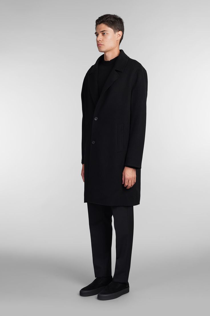 Coat double Coat in black wool, classic revers, long sleeves, frontal buttons closure, welt pockets, buttons on neck, back slip, 100% wool, Made in China, Model is 183 cm and wears size L Black Wool Coat For Work With Double Button Closure, Black Wool Coat With Double Button Closure For Work, Modern Black Wool Coat With Double Button Closure, Black Wool Coat With Double Button For Work, Modern Black Wool Coat With Button Closure, Classic Outerwear With Straight Hem For Winter, Classic Outerwear With Concealed Placket And Straight Hem, Formal Wool Coat With Concealed Placket, Classic Outerwear With Straight Hem And Concealed Placket