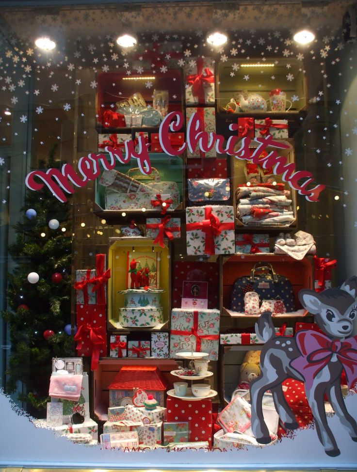 a christmas window display with presents and gifts