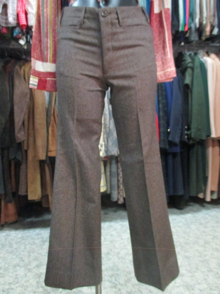 "Original 60s deadstock flared pants. NOS 60s trousers. Mods style. Made in Italy. They feature a jean model, such as the brown woollen cloth fabric whose weft threads are placed diagonally (see pic.9). Low waist with belt loops and besom pockets (pics 1-3). No back pockets (pic.5). Front zipper and button. Mint conditions. They fit size S, about 28 US Measurements: (lay flat and double waist, hips and thigh)) pls. consider the rise in order to calculate the waistline Waist 28.3\" rise 9.05\" hi Retro Wide Leg Pants For Fall, Brown Flare Work Pants, Brown Wool Pants For Winter, Fitted Brown Dress Pants For Fall, Brown Fitted Dress Pants For Fall, Retro Fitted Bottoms For Winter, Retro Fitted Winter Bottoms, Brown Wide Leg Dress Pants For Fall, Vintage Full Length Bottoms For Winter