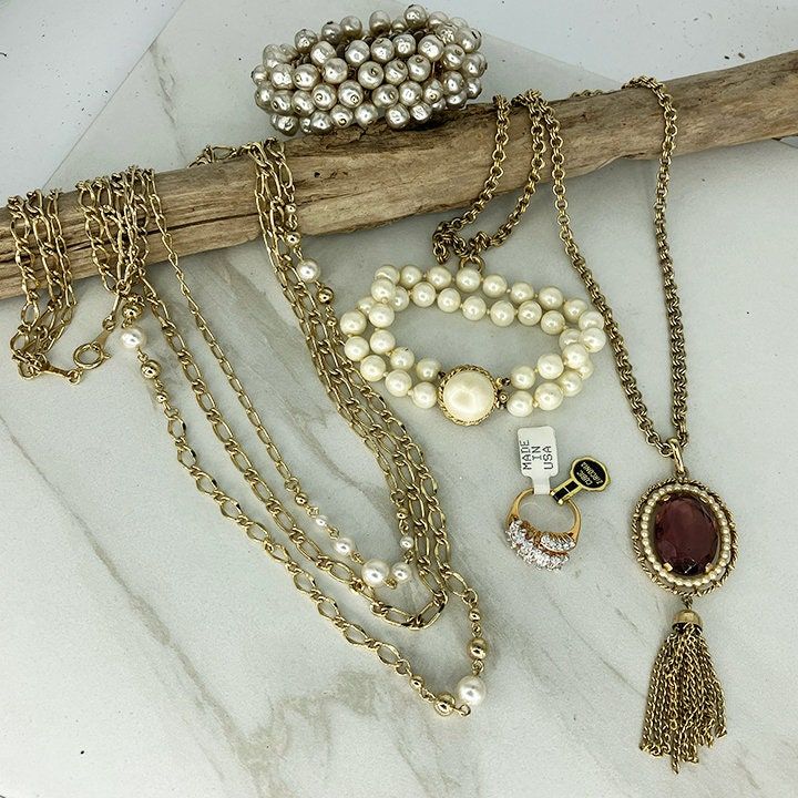 Vintage Jewelry LOT of 5 * Faux Pearl Necklaces and Faux Pearl Bracelets *  Vintage CZ Ring with tags * VOGUE, Avon * Vintage Pearl Bracelet All in very good condition with no wear to the finish to note - see descriptions below for each item.  Any discoloration in the photos is from reflections. Necklace - shiny goldtone links in 3 layers, paired with faux pearls on the shortest and longest strands. Made as 1 necklace with 1 clasp. Longest strand is 31" long. Bracelet - Cha-Cha bracelet in goldtone with loads of faux baroque pearls. Stretches to fit most wrists. Baroque pearls are in great condition - Goldtone is faded on the inside of the bracelet where it rubs against your wrist...Still looks nice to wear!  I am not certain all the beads are present but could not find any spaces where th Bracelets Vintage, Pearl Clasp, Avon Vintage, Faux Pearl Bracelet, Pearl Bracelets, Pearl Necklaces, Vintage Pearl, Purple Rhinestone, Faux Pearl Necklace