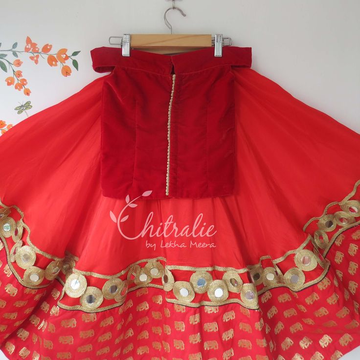 This ethnic lehenga featuring ELEPHANT hand worked Red Velvet Choli and ELEPHANT boarder Banarassi Brocade Skirt accompanied with an Exquisite Embroidered Dupatta. Please Visit My Shop For More Unique Collection https://www.etsy.com/shop/Chitralie Fabric and Work Choli: Red velvet Off-the shoulder choli embellished with a beautiful handwork of elephant design done by a well trained artisan from West Bengal. The choli is lined in soft cotton fabric and ties at the back. There Potri buttons gives Red Art Silk Lehenga With Gota Work, Fitted Lehenga For Festival Celebration, Fitted Red Lehenga With Gota Work, Red Art Silk Sets With Mirror Work, Fitted Skirt Set With Dori Work For Festive Season, Fitted Red Choli With Gota Work, Festive Fitted Skirt Set With Dori Work, Fitted Festive Skirt Set With Dori Work, Anarkali Skirt Set With Zari Work For Festive Occasions