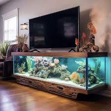 a fish tank sitting on top of a hard wood floor next to a flat screen tv