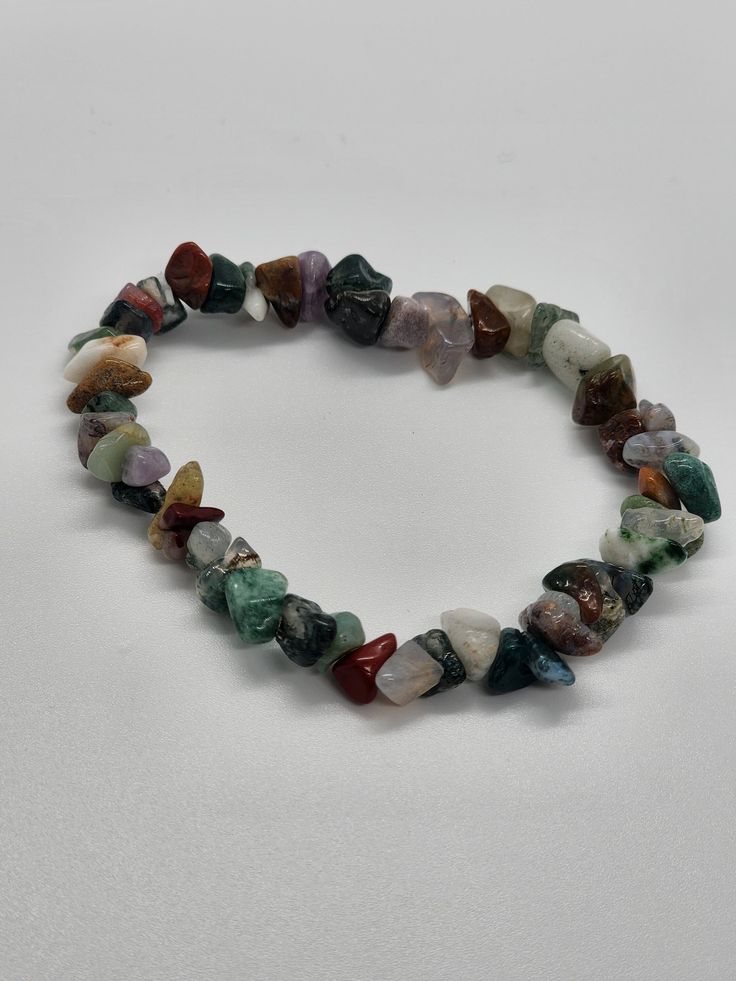 Multi- Colored Chipped stone beaded bracelet with smiley charms, Chip Bracelets, Chakra Healing Crystal Chip Bracelets, Handmade Stretch Bracelets, Stone Bracelets, Inexpensive Jewelry, Low Priced, Healing FREE SHIPPING Handmade item: Bracelet Size: 6-7 Inches (If you contact me I can customize if requested Due to the unique nature of each stone, your item may vary slightly from the picture shown. All items are cleansed with white sage before being shipped. *All crystal healing information provided is intended for spiritual guidance. It is not intended as a substitute for medical advice or service. Any comments, questions, or concerns feel free to contact me, I am here to help! Video is to catch your eye with the beads  Video Credit to @iridescentcrystal_ Casual Multicolor Bracelets With Gemstone Beads, Casual Multicolor Gemstone Beads Bracelet, Casual Multicolor Natural Stones Bracelets, Casual Multicolor Stretch Bracelet With Natural Stones, Casual Multicolor Stretch Bracelet For Healing, Casual Multicolor Natural Stones Stretch Bracelet, Chip Bead Jewelry, Crystal Stone Bracelet, Crystal Chip Bracelet