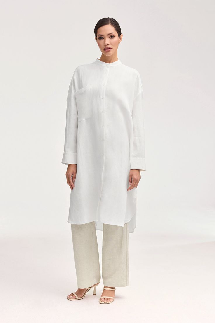 Elevate your summer wardrobe with our luxurious Linen Longline Button Down Top in White. Crafted from cool and breezy linen, this tunic-length cover up is perfect to wear as a standalone piece or a stylish layering option. Embrace effortless elegance in our white button down top. Model is 5'7" and is wearing size XS. White Dress Formal, Dresses Flowy, Nikkah Dress, Engagement Dresses, Kids Outerwear, White Button Down, Bamboo Silk, Dress Satin, Basic Dress