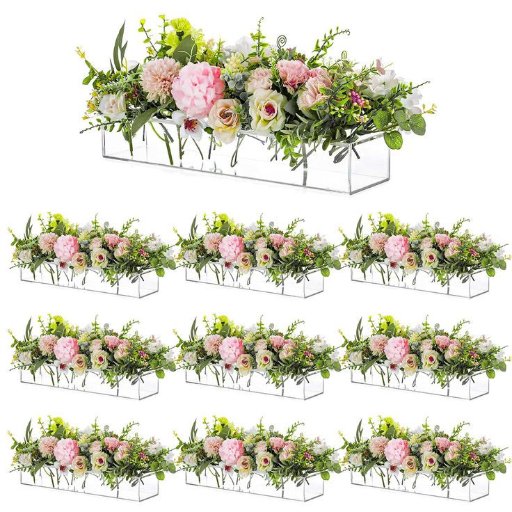 a bunch of flowers that are sitting in a planter on a white background,