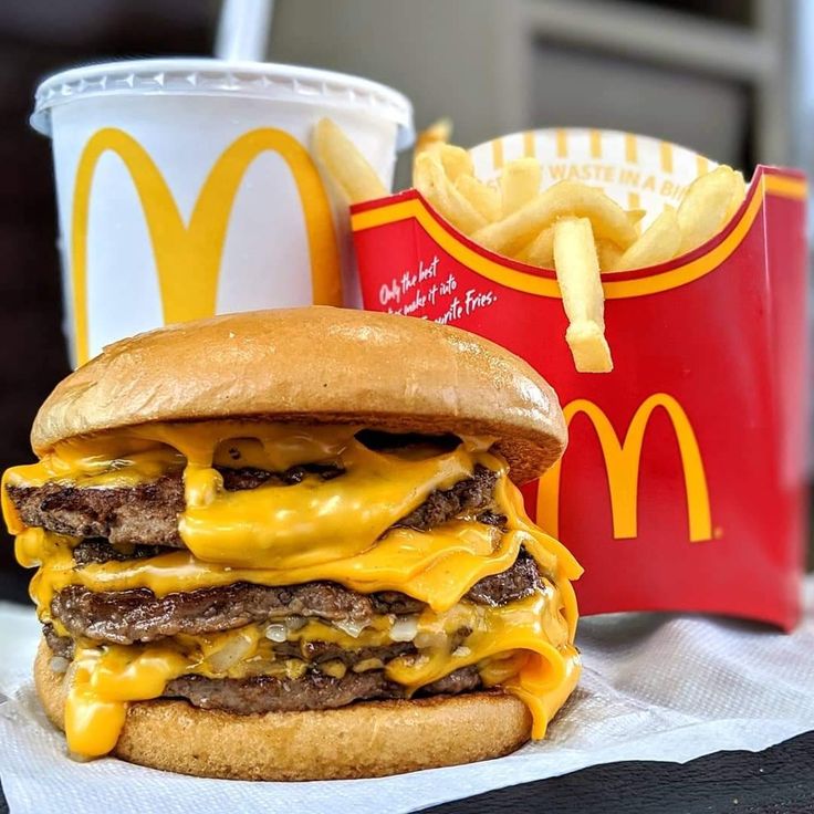 a cheeseburger and fries are sitting on a table