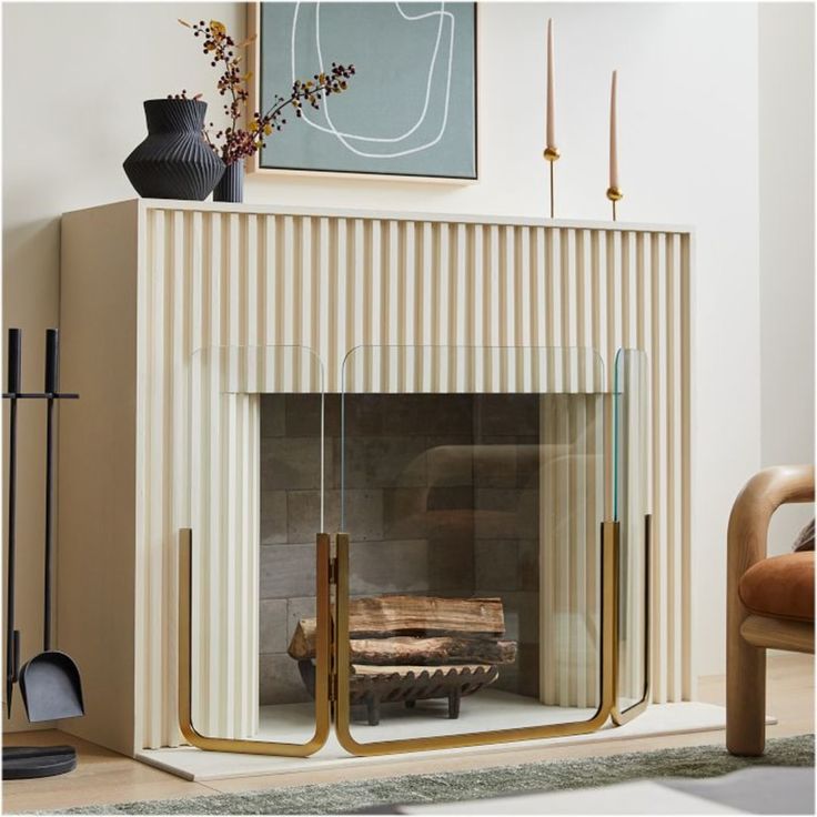 a living room with a fire place and a painting on the wall