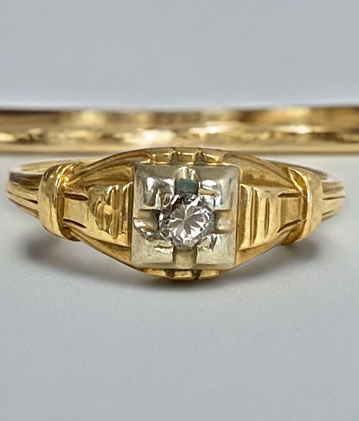 Antique 14k Yellow Gold .07 CTW Diamond Ring Size 6.5 Beauty! A truly superb vintage ring, crafted beautifully in solid 14K gold. * Great worn as a pre-engagement or promise ring or a right hand ring. * In BEAUTIFUL original condition. * Weight: 1.7 grams * Stones: 1 -.07ct round diamond is set into the center mount. Will ship FAST and FREE, in a gift box and fully insured :) Victorian 14k Gold Diamond Cut Rings, Vintage Diamond Cut Signet Promise Ring, Antique 14k Gold Solitaire Jewelry, Antique Signet Ring With Diamond For Anniversary, Vintage Signet Ring With Single Diamond For Formal Occasions, Vintage Engraved Ring With Single Diamond For Formal Occasions, Vintage Diamond-cut Signet Promise Ring, Vintage Single Diamond Jewelry With Round Band, Vintage Yellow Gold Signet Ring With Single Diamond