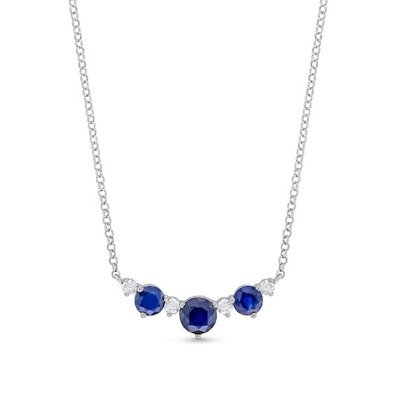 Mark any special occasion with the regal look of this gemstone and diamond necklace. Sterling silver At the center, a deep 5.0mm natural blue sapphire is flanked by round diamonds and 4.0mm blue sapphires 1/6 ct. t.w. of diamonds 18.0-inch rolo chain; lobster claw clasp Formal Sapphire Necklace With Single Cut Diamonds, Elegant Blue Necklace With Single Cut Diamonds, Classic Sapphire Diamond Necklace For Formal Occasions, Blue Round Necklaces With Single Cut Diamonds, Classic Sapphire Necklace For Formal Occasions, Classic Formal Sapphire Diamond Necklace, Fine Jewelry With Sapphire And Single Cut Diamonds, Classic Sapphire Necklace In White Gold, Classic White Gold Sapphire Necklace