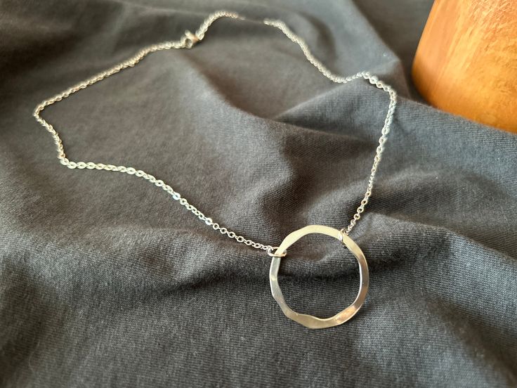 Discover the timeless beauty of our Sterling Silver Circle Necklace, an exquisite piece that adds a touch of elegance to any ensemble. Handcrafted with precision, this necklace features a delicate circle pendant that shines brilliantly in any light. Product information  - Pendant size: 28 mm - The chain is made of stainless steel so it has a good weight. - The chain is cast in 100% silver water for one day and then plated. It will never tarnish or yellow and is long lasting.  It is color and material tested and made of materials that are completely harmless to the skin.  - Keep your jewelry away from perfume, water and chemical liquids for long-lasting use. - This necklace is custom made. Therefore I need 3-5 days to make your Necklace. Then I will pack it and I will send it to you. Feel f Elegant Open Circle Silver Necklace, Elegant Silver Open Circle Necklace, Elegant Silver Circle Necklace, Nickel Free Necklace For Anniversary, Hypoallergenic Open Circle Jewelry For Anniversary, Hypoallergenic Open Circle Anniversary Jewelry, Nickel-free Necklace For Anniversary, Nickel-free Round Necklace For Anniversary, Elegant Silver Full Circle Necklace