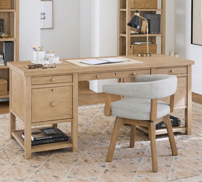 a wooden desk with two chairs in front of it