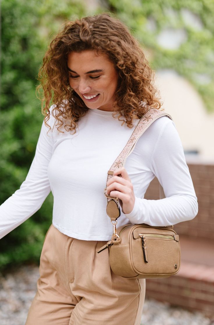 Introducing the Gentry Crossbody, a must-have boho bag for the fashion-forward and free-spirited. This medium-sized crossbody is crafted from premium vegan leather to withstand the test of time. It's complete with unique, boho-chic touches like braided vegan leather zipper pulls and a detachable woven strap. Details: 8.75" wide x 5.5" long x 3.25" deep Front pocket: 6" wide x 3" long 1 interior zippered pocket 1 interior slip pocket Braided vegan leather zipper pulls Strap adjusts from 33"-50" long; 2" wide Fall Camel Shoulder Bag With Adjustable Strap, Bohemian Crossbody Saddle Bag, Bohemian Shoulder Bag With Adjustable Strap For Fall, Spring Crossbody Hobo Bag With Adjustable Strap, Trendy Camel Shoulder Bag With Adjustable Strap, Day Out Satchel With Adjustable Strap, Crossbody, Brown Shoulder Bag For Spring On-the-go, Day Out Crossbody Satchel With Adjustable Strap, Bohemian Bag Strap For Everyday Use