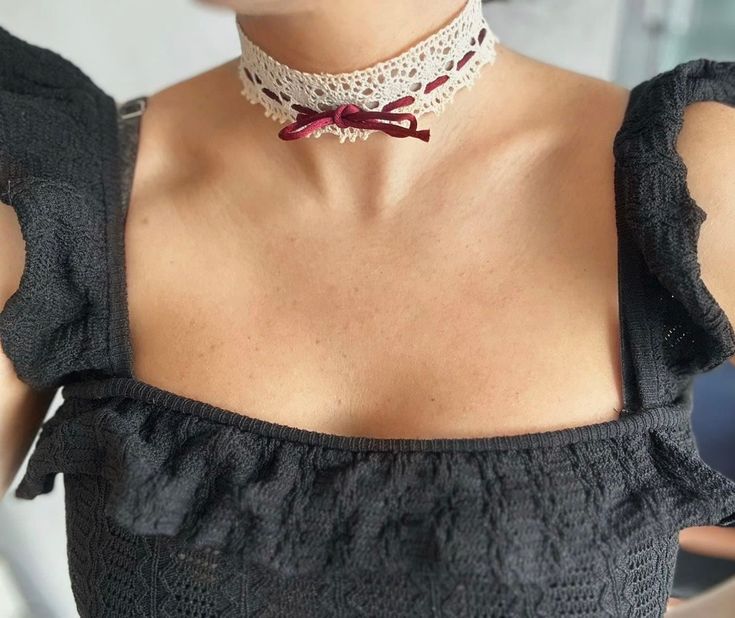 A gorgeous Offwhite lace choker with a Bordeaux ribbon. It is a simple yet a beautiful piece of jewelry that  adds a nice elegant touch to any outifut. This choker makes a beautiful valentines day gift due to its lacey romantic fabric and rich bordeaux ribbon color. It looks beautiful on its own or stacked along with other necklaces as shown in the pictures above. The choker is 12 inches long and comes with a 3 inch extension chain. This item takes 1-2 business days to be processed and shipped. Elegant Lace Choker As Gift, Lace Trim Choker Jewelry Gift, Vintage Lace Choker As A Gift, Vintage Lace Choker For Gifts, Lace Choker With Lace Trim As Gift, Vintage White Choker For Gift, Romantic Fabric, Ribbon Choker, Lace Choker