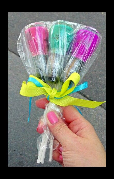 a person holding some candy sticks wrapped in plastic