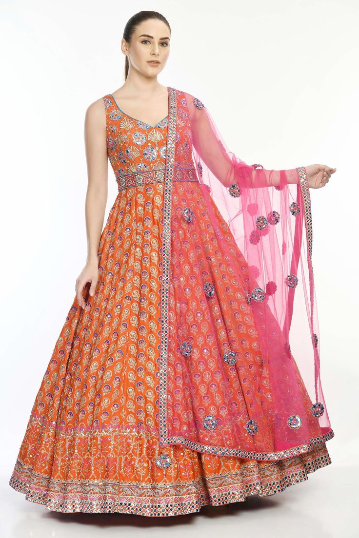 Orange anarkali with floral motif embroidery highlighted with mirror work. Comes with mirror work dupatta.
Components:2
Pattern:Embroidered
Type of Work:Mirror Work
Neckline:V-Neck
Sleeve Length:Sleeveless
Fabric:Crepe, Modal Satin, Butterfly Net
Color:Orange
Other Details:
Beaded neckline
Floral motifs
Occasion:Bride,Wedding - Aza Fashions White Angrakha, V Neck Anarkali, Orange Anarkali, Angrakha Anarkali, Nikhil Thampi, Ridhima Bhasin, Salwar Neck Designs, Cape Jumpsuit, Motif Embroidery