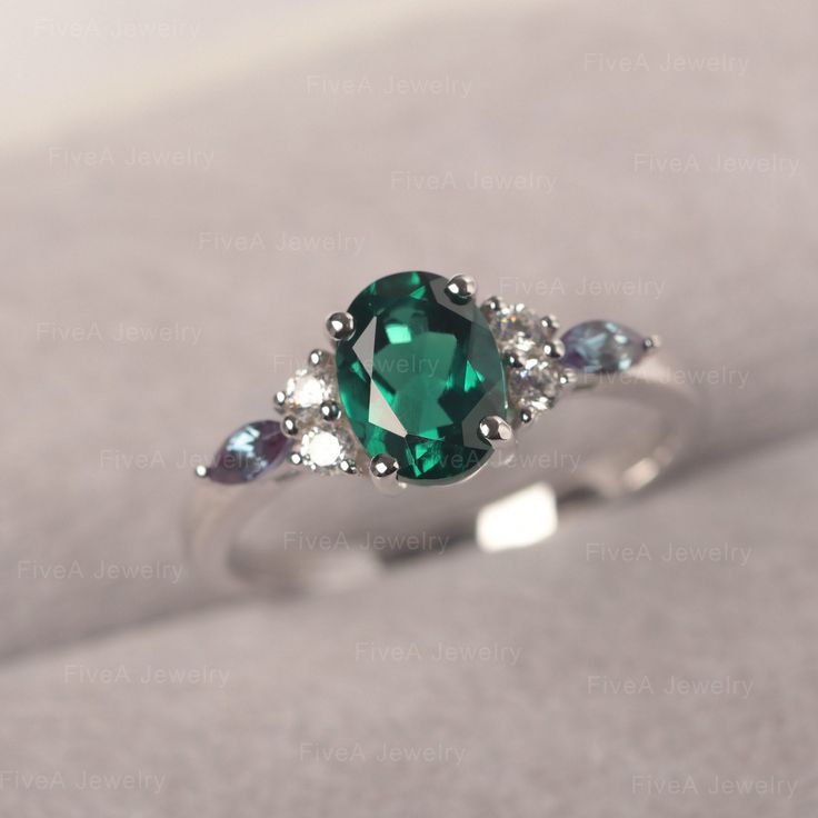 * The delicate ring displays Emerald as main stone. The cluster side stones make the ring similar to the blooming flower . For who wearing this special & delicate ring, will shine like a goddess. ◆ Production Description: Main stone Type: Emerald Main Stone Shape: Oval Cut Main Stone Size: 6*8mm (1.13ct) Side stone: CZ & lab Alexandrite Metal: 925 Sterling silver - Other options available in the drop down menu ◆ Customization: √Free for Add Engraving √Other Metal Type Available √Other Ge Dainty Oval Crystal Ring With Accent Stones, Oval Cluster Ring With May Birthstone Accent Stones, Oval Crystal Promise Ring For May Birthstone, Oval Multi-stone Rings For May Birthstone, Oval Crystal Ring With Gemstone Accents For Promise, Oval Crystal Promise Ring With Accent Stones, Oval Multi-stone Crystal Promise Ring, Oval Emerald Crystal Ring With Birthstone, Oval Emerald Crystal Ring With Gemstone