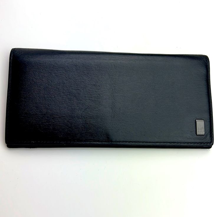 Dunhill Black Leather Long Bifold Wallet Minimalist Style Card Holder Authentic Soft Luxury Leather, Light, Almost Flat /If Without Cards And Inserts. Large Wallet With Multiple 10 Card Slots,3 Bill Slots That Can Fit A Checking Book As Well, A Long Coin Pouch. Logo Outside And Inside. Flat Measurements Approximately: Length 19 Cm / 7.5 Inches Height 10 Cm / 3.9 Inches The Over All Is Very Good Condition, O Noticeable Damage, Gently Used. Please Check The Photos For More Details. *The Exterior Is Rubbed With Micro Rubs And Scratches. No Major Flaws Noted ~ Very Gently Used. No Original Packages Left. Do Not Hesitate To Ask Any Questions Or Negotiate The Terms. Use Bund Wallet Minimalist, Soft Luxury, Large Wallet, Minimalist Wallet, Bifold Wallet, Coin Pouch, Minimalist Style, Minimalist Fashion, Card Slots