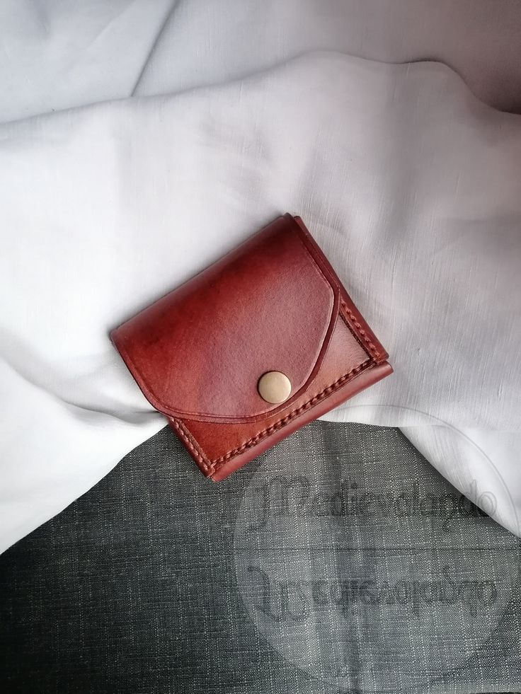 Made with top quality 100% Italian leather, hand-sewn with a resistant and repairable waxed thread, the leather is first colored by hand and then treated with a special cream that protects it and keeps it soft. Completely handmade. This mini wallet with a minimal, compact and slim design is perfect to keep in your pocket and is useful in all those situations where you need to have credit cards, documents and banknotes with you, but you don't have room for a normal wallet thick and chunky. The petite size and thinness makes it a perfect complement to the belt bags used by those who attend festivals, concerts or love bushcraft! Being able to insert it in pockets, even inside jackets, also allows you to avoid being robbed on public transport and when you are in areas crowded with people. It c Leather Card Holder With Waxed Finish As Gift, Leather Hand-stitched Coin Purse For Everyday Use, Leather Wallet With Leather Lining As Gift, Hand-stitched Leather Trifold Wallet, Hand-stitched Leather Rectangular Coin Purse, Hand-stitched Rectangular Leather Coin Purse, Handmade Leather Bifold Bag, Classic Leather Trifold Wallet Hand-stitched, Hand-stitched Brown Leather Coin Purse