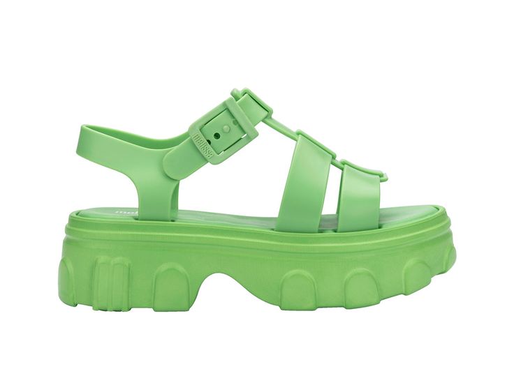 Introducing another stand-out model in the Melissa Universe. Meet the Ella, a chunky sandal with a robust and textured sole in the streetwear style found all over the catwalks. A fisherman style upper and light-as-air insole give this sandal a double-pinch of originality and creativity. Modern Platform Jelly Sandals With Round Toe, Green Chunky Platform Sandals With Round Toe, Summer Platform Sandals For Streetwear, Chunky Platform Sport Sandals For Beach In Spring, Trendy Chunky Platform Sport Sandals For The Beach, Chunky Platform Sport Sandals For Summer Beach, Summer Streetwear Platform Sandals, Green Sandals With Textured Sole For Spring, Spring Green Sandals With Textured Sole