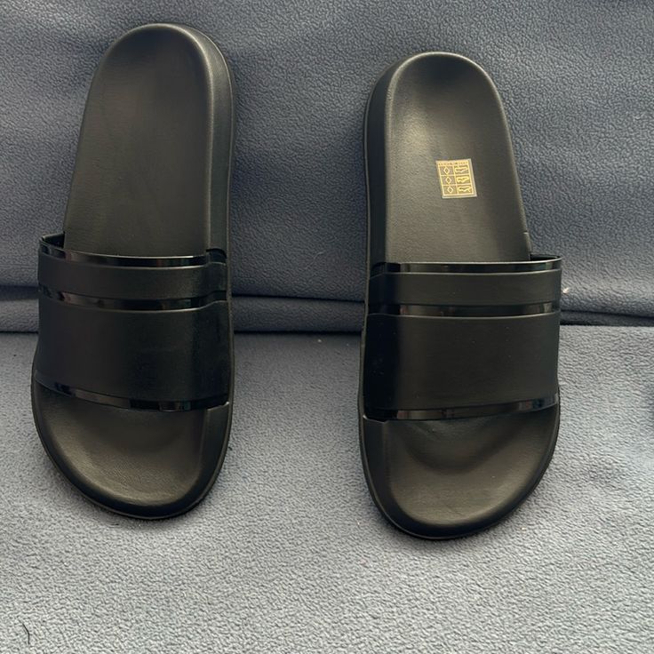 Black Size 7.58 Soft Materials. Casual Black Slide Jelly Sandals, Casual Black Jelly Slide Sandals, Black Slip-on Jelly Sandals Casual, Black Casual Slip-on Jelly Sandals, Casual Black Jelly Sandals For Vacation, Casual Black Slip-on Jelly Sandals, Black Slip-on Synthetic Jelly Sandals, Black Open Toe Synthetic Sandals, Black Synthetic Open Toe Sandals