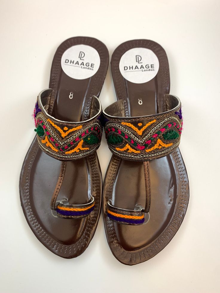 * Please note that if you have wide feet, you will need to size up*  dhaage.london We Bring you our latest collection.  These beautiful Kolapuri Chappal are Handcrafted, incredible soft and anti slip sole. Comfort and style all in one.   . . . #jutti #khussa #shoes #punjabishoes #juttilovers #summer #desiclothes #casualshoes #indian #pakistani #desi #fashion #desifashion #kaleeray #accessories #tradionalshoes #handmade #summer #summervibes #wedding #desiwedding #partywear #eid #simplekhussa #pak Traditional Sandals With Single Toe Strap For Festive Occasions, Traditional Closed Toe Toe Ring Sandals For Festivals, Traditional Festive Sandals With Single Toe Strap, Festive Sandals With Gota Work And Single Toe Strap, Traditional Slip-on Sandals For Festivals, Traditional Open Toe Sandals For Festivals, Traditional Multicolor Sandals With Round Toe, Traditional Toe Ring Sandals For Festivals, Festive Open Toe Sandals For Festival