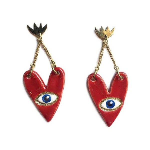 two red heart shaped earrings with gold chains hanging from each side and an evil eye in the middle