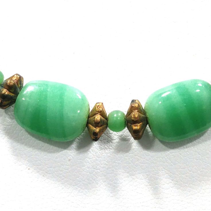 *Description: This necklace is made from faux jade green glass beads that have small air bubbles in them from the 1930s or before. They would be perfect to restring as they are most likely antique beads and the metal plated findings did not hold up as well as the glass beads. Unchecked from a gem tester, you would believe these to be jade but they are indeed glass. Looking closely with a loop, you can see the air bubbles within many of the glass beads. The necklace is 15 inches in length. This w Bead Choker Necklace, Formal Earrings, Vintage Christmas Gifts, Bead Choker, Curling Ribbon, Beaded Choker Necklace, Air Bubbles, Beaded Choker, Jade Green