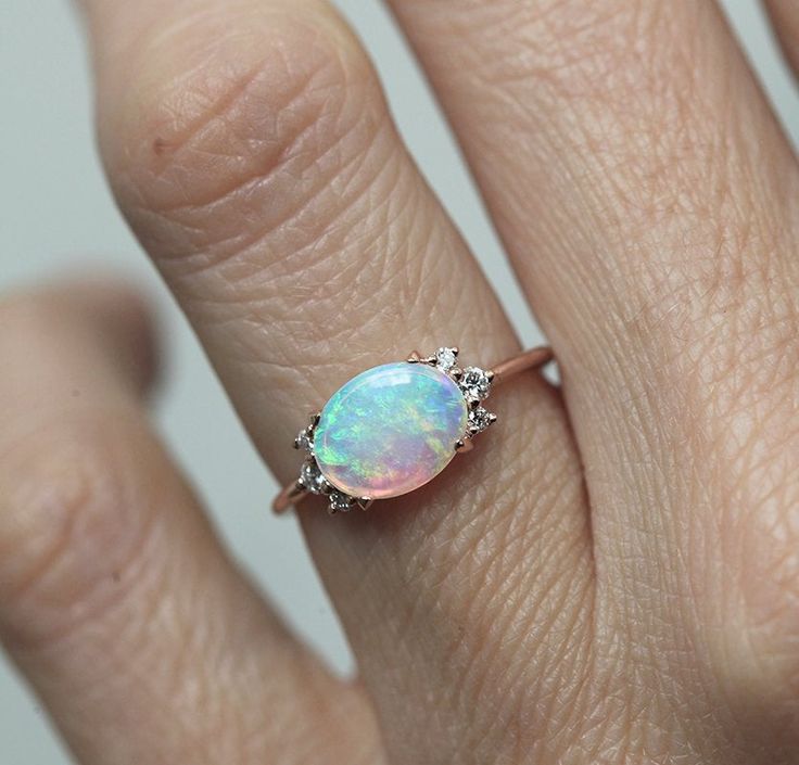 A gorgeous prong set Australian opal & diamond cluster engagement ring in 14k or 18k solid gold or platinum. The opal shines in a variety of special colors (blue, green, white, pink, ...). Lots of fire! This unique multi stone engagement, wedding or bridal cluster is available in 14k and 18k solid rose, white, yellow gold and platinum. Please select the material and ring size from the drop-down menu on the right side of the listing. If you have any questions, please send us a message. If you Ethiopian Opal Oval Ring For Wedding, Elegant Oval Pink Opal Ring, Oval Pink Opal Ring For Wedding, Oval Opal Cluster Ring For Wedding, Oval Opal Ring, Morganite Engagement Ring Oval, Gold Opal Ring, Ruby Wedding Rings, Rose Gold Opal Ring