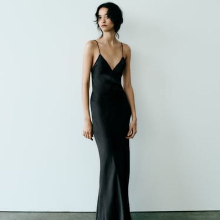 Satin Slip Dress Midi Dress With V-Neckline And Spaghetti Straps. Open Back. Black | 8325/840 Elegant Black Slip Dress, Vintage Slip Dress Aesthetic, Sleek V-neck Maxi Dress For Date Night, Summer V-neck Evening Dress For Dinner, Black Long Slip Dress For Party, Black Satin V-neck Evening Dress, Black V-neck Evening Dress For Night Out, Sleek V-neck Maxi Dress For Evening, Sleek V-neck Evening Maxi Dress