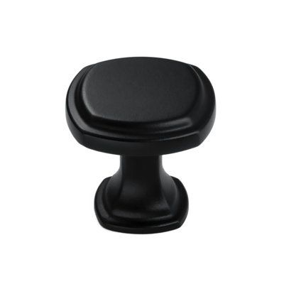 a black cabinet knob on a white background