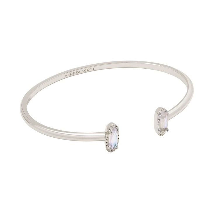 Looking for a pop of sparkle to add to your wrist stack? Meet the Emma Cuff Bracelet, aka your new style essential. Two elongated stones bookend this adjustable metal cuff you can fit to your wrist perfectly. On-trend and oh-so-cute, you'll style this bracelet time and time again. Designer, founder, and philanthropist Kendra Scott started her company in 2002, just three months after her first son was born. Her commitment to innovation, quality, customer service, and detail has taken her from a s Wrist Stack, College Closet, Kendra Scott Silver, Jewelry Kendra Scott, Kendra Scott Bracelet, Statement Cuff Bracelet, Wrist Stacks, Brass Cuff Bracelet, Target Gifts