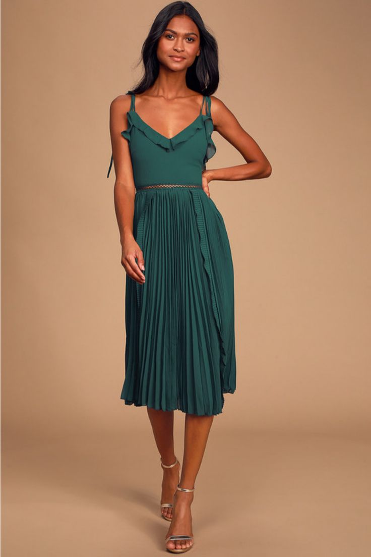 A great day begins with the Lulus Never a Dull Moment Emerald Green Tie-Strap Pleated Midi Dress! Lightweight, woven chiffon shapes this darling dress with adjustable tying straps and a ruffled, V-neckline. Darted bodice carries into a fitted waist, accented with sheer, pierced embroidery, and a pleated midi skirt with ruffled trim that trails down the sides. Hidden back zipper/clasp. Fit: This garment fits true to size. Length: Knee to mid-calf length. Size medium measures 40" from top to bottom. Bust: Great for any cup size. Waist: Fitted - very fitted at natural waist. Hip: Not Fitted - fuller skirt allows room for hips. Undergarments: May be worn with an adhesive bra, petals, or no bra. Fabric: Fabric has no stretch. Fully lined. Shell: 100% Polyester. Lining: 100% Polyester. Exclusive Chic Chiffon Dress With Tie Straps, Sleeveless Pleated Midi Dress For Brunch, Green Midi Dress With Ruffled Straps For Spring, Chiffon Dress With Spaghetti Tie Straps, Fitted Chiffon Dresses With Tie Straps, Party Midi Dress With Adjustable Ruffled Straps, Green Strap Dress For Date Night, Summer Chiffon Dress With Tie Straps, Chiffon Dress With Ruffled Straps For Brunch