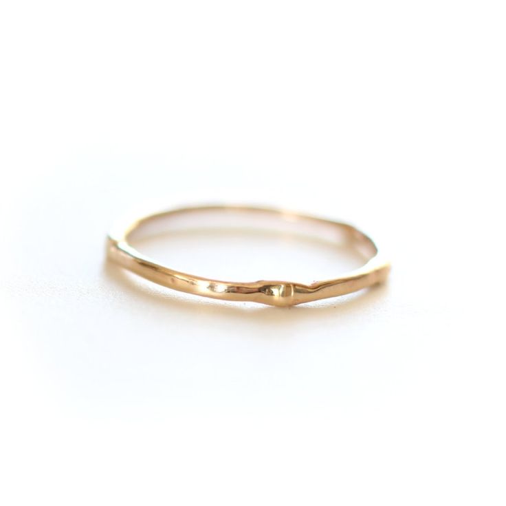 Introducing the original Dainty Ring - a must-have for every ring stack! Made from 14k yellow gold, this ring is both delicate and chic. Wear it alone for a minimalist look or stack it up to create a personalized set. Handcrafted with care, each ring is unique, showcasing its own rustic character. Measuring 1mm in width, this ring is the perfect addition to your jewelry collection. • Please note that Amy will need two weeks to create your ring with utmost attention to detail. Everyday Fine Jewelry: 14k Gold Stackable Rings, Everyday 14k Gold Fine Jewelry Stackable Rings, Everyday 14k Gold Stackable Rings Fine Jewelry, Everyday 14k Gold Stackable Rings, Fine Jewelry 14k Gold Stackable Toe Rings, Fine Jewelry 14k Gold Toe Stackable Rings, 14k Gold Fine Jewelry Stackable Toe Rings, 14k Gold Toe Ring Stackable Fine Jewelry, Dainty Stackable Rings In Recycled Gold For Promise