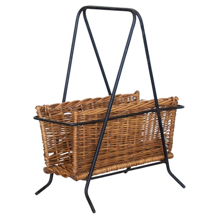 a wicker basket on a metal stand