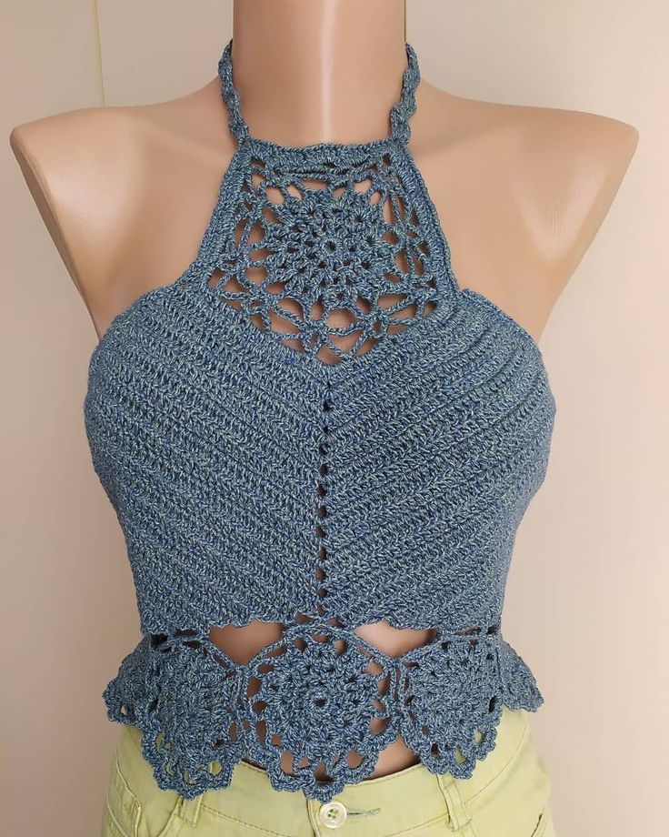 Elevate your summer wardrobe with our Handmade Crochet Halter Top, designed for boho-chic lovers and festival-goers. 🌞 This unique piece is perfect for beachwear or casual outings. Handmade Craftsmanship: Each top is intricately crocheted by skilled artisans, ensuring high quality and attention to detail. Boho Style: Embrace your inner bohemian with this stylish and airy halter top, perfect for summer vibes. Comfortable Fit: The adjustable tie at the neck and secure buttons at the back ensure a Fitted Summer Crochet Top For Festivals, Bohemian Handmade Crop Top For Spring, Handmade Bohemian Crop Top For Summer, Bohemian Handmade Crop Top For Summer, Handmade Hippie Tops For Summer, Bohemian Cotton Halter Top For Spring, Handmade Blue Tops For Festival, Handmade Hippie Crop Top For Spring, Bohemian Crop Top For Beach Season