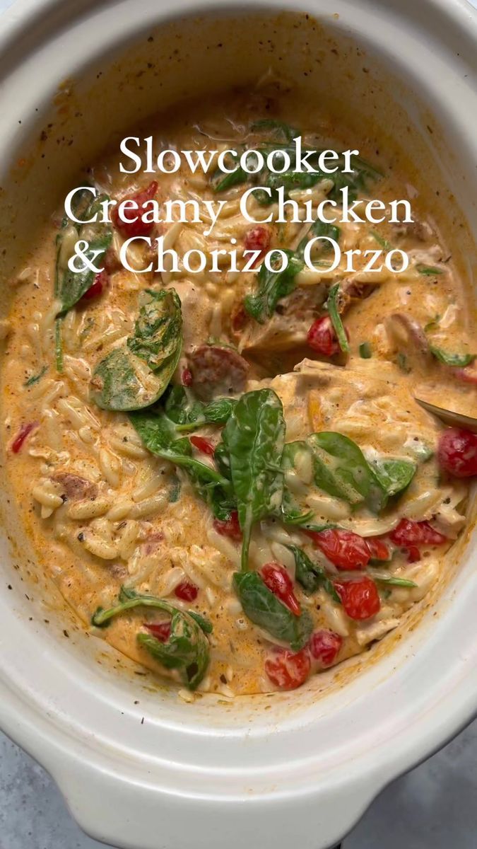 slow cooker creamy chicken and chorizo orzo soup in a crock pot