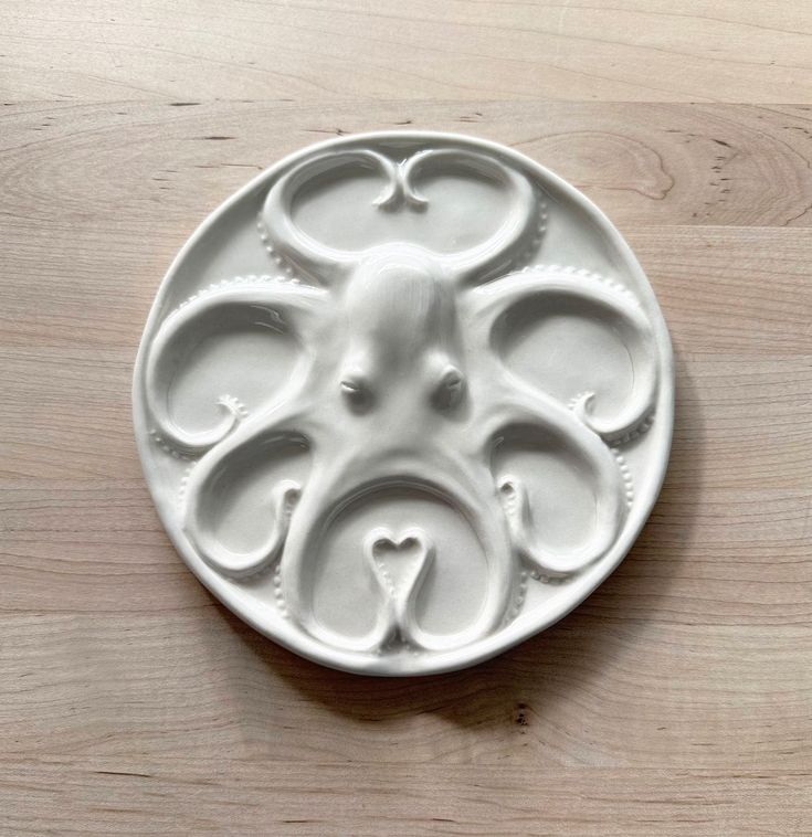 a white plate with an animal design on it